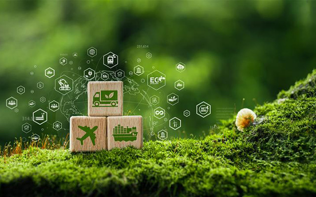 three toy building blocks depicting shipping methods sit on green moss