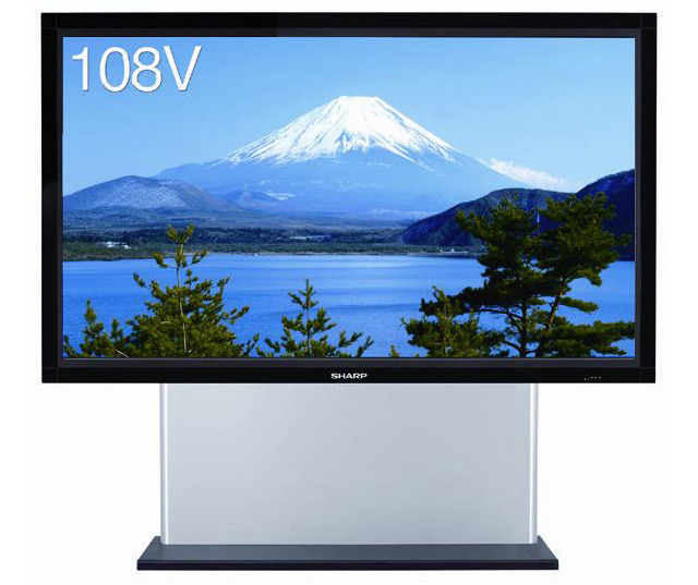 A large format display mounted on a floor stand showing images of Mount Fuji